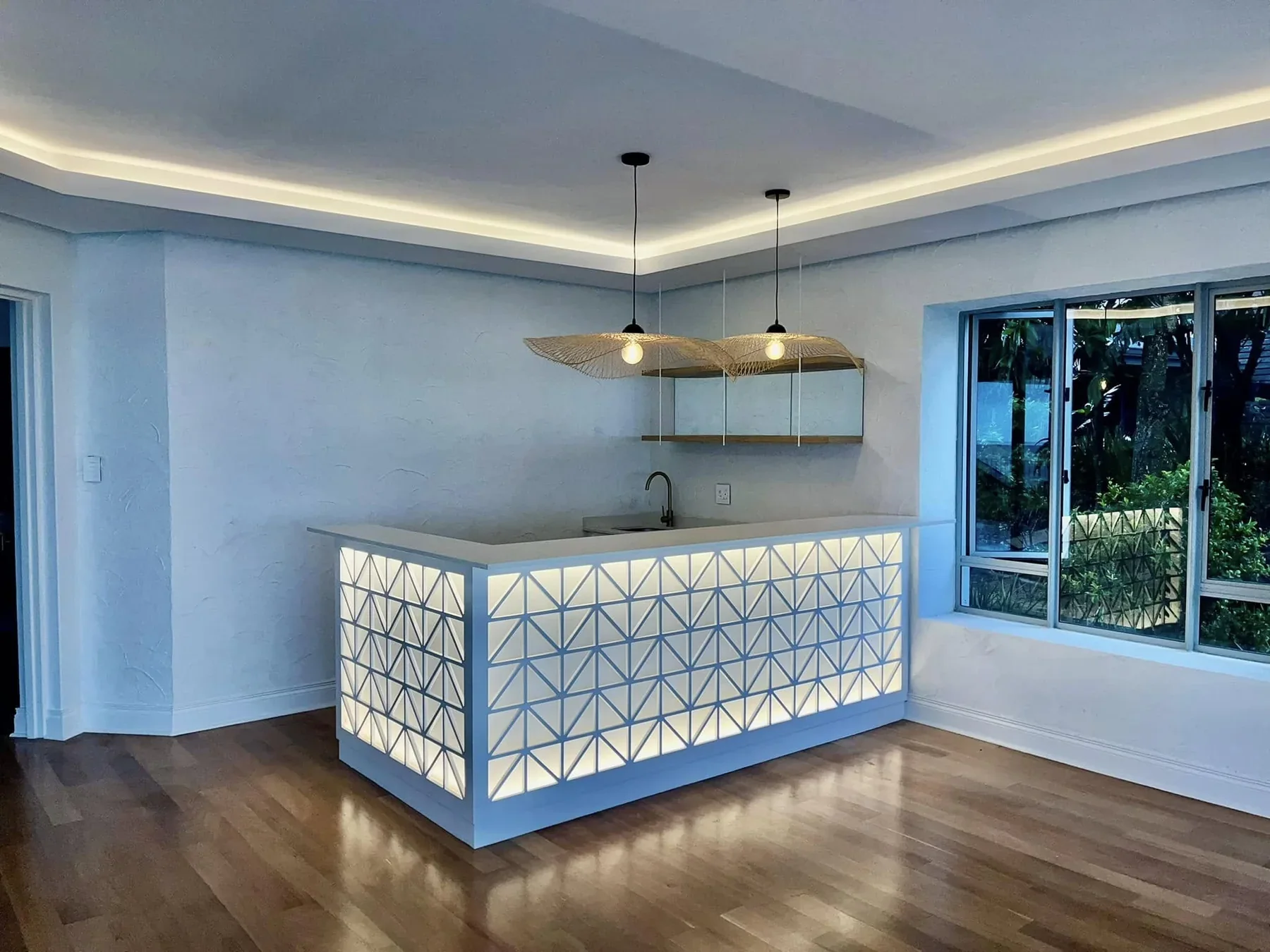 Illuminated custom home bar by Country Kitchens